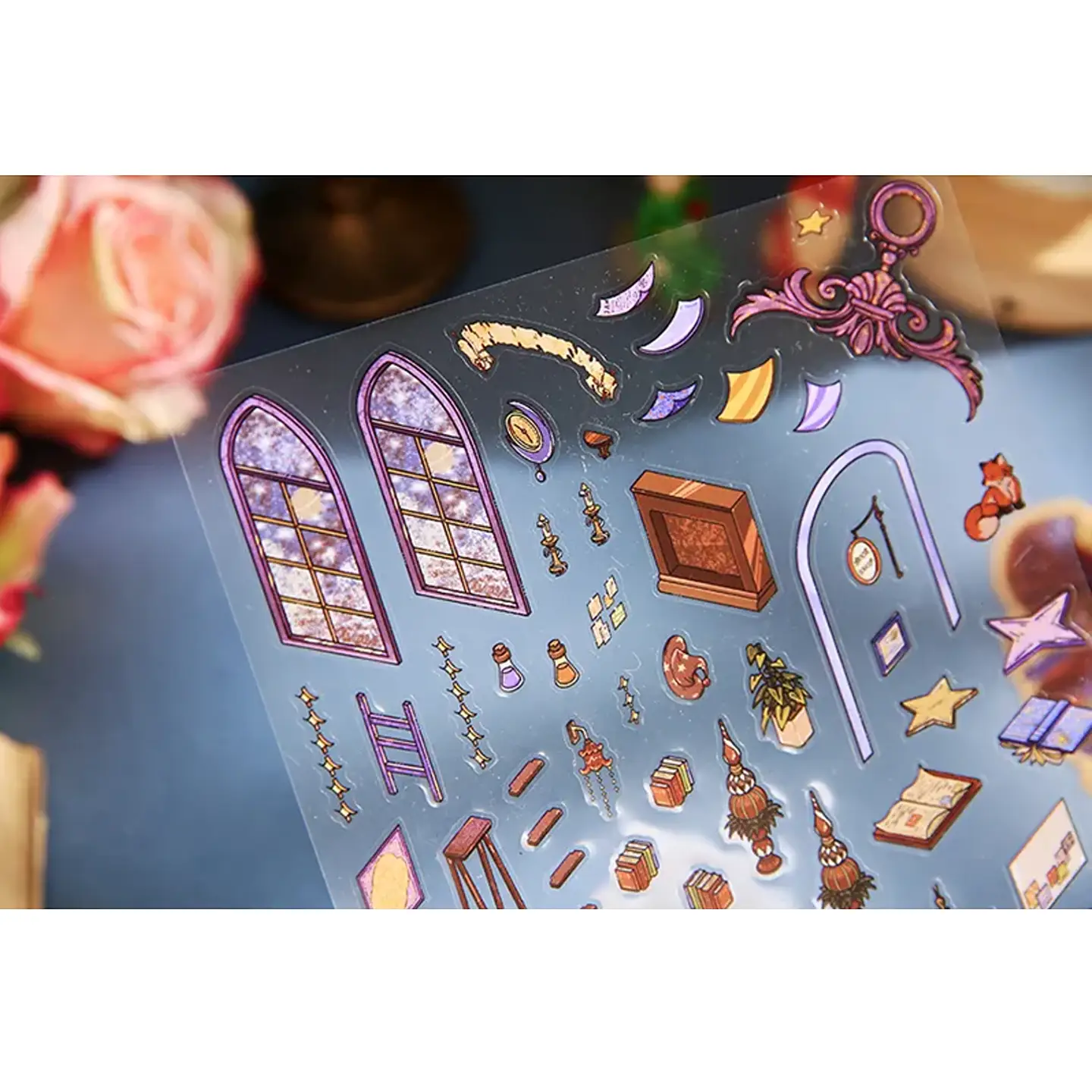 The Little Prince Scene Stickers | 2.0 Series – Magical Bookstore from ASMR Stickers transports you into a whimsical literary haven. This 3D scene sticker showcases a beautifully detailed bookstore filled with towering bookshelves, antique lamps, and enchanting scrolls, creating a cozy and immersive atmosphere. The upper level features a reading nook with The Little Prince surrounded by books, a desk, and decorative elements, while the lower level presents a workspace with more books, scrolls, and a fox companion. Large arched windows, chandeliers, and intricate shelves enhance the magical ambiance, making this sticker visually captivating. Perfect for DIY sticker decoration, planner embellishments, and creative journaling, this high-quality, reusable sticker set is ideal for book lovers, ASMR enthusiasts, and collectors. Elevate your projects with the charm of the Magical Bookstore, where literature and fantasy intertwine in a breathtaking display.